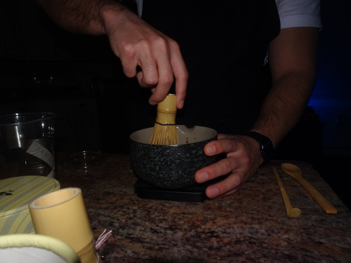 A hand whisking